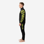 Custom camo soccer tracksuit right side profile displaying digital camo sleeve and tapered black pant on male model