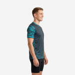 Side view of custom camo soccer training jersey showing teal camo-hex pattern flowing from sleeve to lower body panel