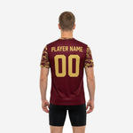 Close detail of Vegas Gold digital hex-dot camo print on short sleeve of custom Maroon soccer training jersey