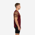 Mens camo soccer training jersey in Maroon and Vegas Gold, left side view showing full camo sleeve coverage and athletic cut