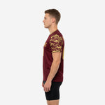 Custom Maroon soccer training jersey with Vegas Gold camo sleeves, right side view displaying sublimated sleeve panel and crew neckline trim