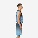 Front view of custom carolina blue basketball uniform set with white team name and number on charcoal-to-blue gradient jersey and matching shorts