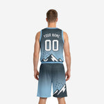 Opposite side view of custom carolina blue basketball uniform set showing gradient fade from charcoal at hip to carolina blue at hem on shorts