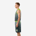 Side view of charcoal basketball uniform set showing neon green armhole binding, jersey length, and matching lightning shorts