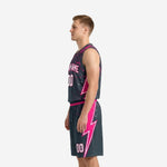 Side profile of custom charcoal basketball uniform set with pink waistband, drawcord shorts, and V-neck sleeveless jersey
