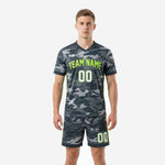 Custom charcoal camo grey soccer uniform with neon green trim, front view, full 2-piece kit on male model