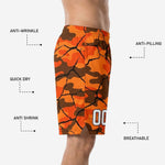 Back view of custom church league basketball shorts in orange camo-crack design showing full sublimation coverage and side split hem