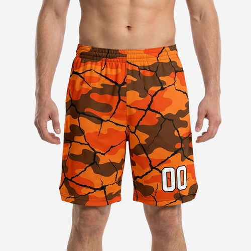 Custom church league basketball shorts in orange and brown camo-crack pattern with white player number 00 on lower right thigh, front view