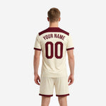 Custom full-dye sublimated cream soccer jersey with maroon yoke crew neck and arced team name print detail