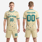 Full kit view of custom cream and teal men's soccer outfits, 2-piece sublimated uniform set for club and team orders