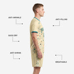 Custom cream soccer shorts side panel showing terrazzo print detail and teal player number on left leg