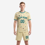 Custom cream and teal men's soccer outfits with terrazzo splash print, crew neck jersey and matching shorts, front view