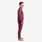 Custom red and black soccer tracksuit left side profile showing slash pattern across jacket and matching track pants on adult male model