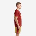 Men's custom crimson soccer jersey with gold trim and Vegas Gold shorts, left side view showing sleeve cuff and side stripe detail