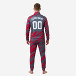 Close detail of custom crimson soccer tracksuit jacket showing team logo placement and chest number on charcoal slash-print sublimated fabric