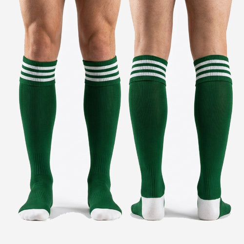 Full length view of custom dark green soccer socks over the calf with white stripe cuff and toe