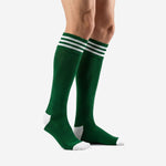 Custom dark green soccer socks side view showing over the calf length and white heel detail