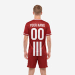 Detail view of custom dark red soccer jersey and shorts showing white crew neck trim and sublimated stripe construction
