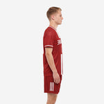 Men's custom dark red soccer uniform side view showing white stripe detail on jersey sleeve cuff and shorts leg panel