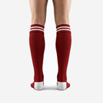 Close-up of dark red soccer socks ribbed cuff with double pure white contrast bands for club identity