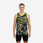 Custom digital camo basketball jerseys in gray charcoal with neon yellow lightning overlay, V-neck binding, team name and number on front, back number shown