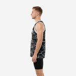 Side view of custom black digital camo basketball jersey showing white armhole binding and straight hem length on male model