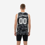 Right side view of custom black and white digital camo basketball jersey displaying the full-panel camo print and side hem detail