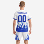 Custom sublimated soccer jersey and shorts set in Royal Blue and White flame design