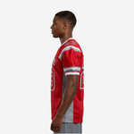 opposite side view of sublimated red football jersey showing grey side panel and sleeve number on shoulder cap