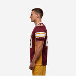 Right side view of maroon and gold sublimated football jersey showing set-in sleeve construction and gold lateral mesh panel on adult male model