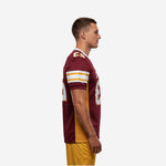 Side view of maroon custom American football jersey showing gold mesh side panel running from armhole to straight hem with gold and white sleeve stripe band