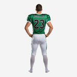 Back view of green and white custom football uniform set showing back number and nameplate area on the sublimated jersey