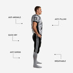 Back view of custom football uniform set in white and black with back number and matching black pants with white outer-leg stripes