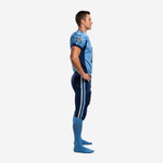 Light blue custom American football uniform with navy shoulder panels, white-outlined front number 75, team name on chest, and matching navy game pants - front view