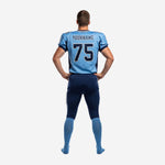 Opposite side view of light blue and navy custom football uniform set showing sublimated jersey side panel and matching pant stripe detail
