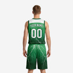 Second side view of forest green basketball uniform set showing sublimated white lightning pattern across jersey and shorts with player number on shorts leg