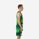Side view of forest green and lime green sublimated basketball uniform showing V-neck binding and shorts drawcord waistband