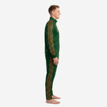 Custom forest green soccer tracksuit side view showing old gold geometric triangle stripe running full length of sleeve and pant leg via full-dye sublimation