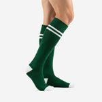 Custom green soccer socks with white double stripe bands and white toe cap, side profile view