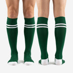 Full-length over-the-calf green soccer socks with white contrast bands, custom team soccer socks