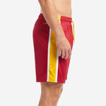 Custom gold soccer shorts showing full-length gold and white side panel on left leg against crimson body
