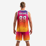 Close detail of custom basketball uniforms showing ink-splatter gradient texture and white trim