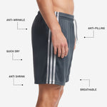 Straight hem and athletic cut detail on custom gray soccer shorts in graphite and white stripe