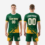 Custom green soccer uniform full kit back view showing player name arc, back number, and matching shorts on male model