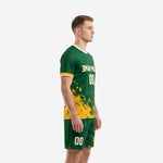 Custom green soccer uniform left side view showing Athletic Gold splash pattern flowing from jersey hem into shorts
