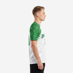 Custom green soccer jersey team short sleeve with Kelly Green feather print raglan sleeve, left side view on male model