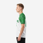 White and Kelly Green custom soccer jersey with feather wing graphic across short sleeve, right side view on male model