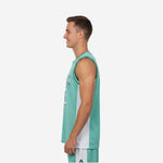 Side view of the custom green basketball jersey showing white side panel construction and armhole binding detail on a male model