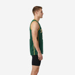Front view of forest-green custom basketball jersey with gold armhole trim and gold vertical side panels on male model
