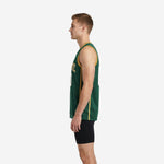 Left side view of custom green and gold basketball jersey showing vertical gold side panel and sleeveless cut